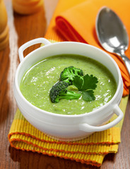 Broccoli cream soup on table