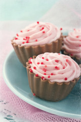 Vintage editing on pink chocolate cupcakes