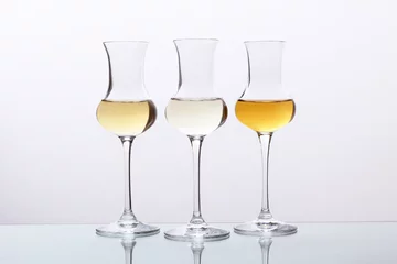 Fotobehang cocktail tre bicchieri con bevanda alcolica grappa © denio109