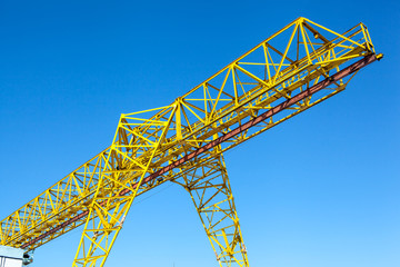 Gantry crane over blue sky