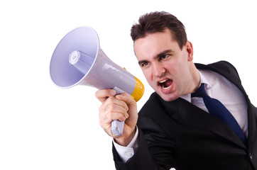 Young businessman with loudspeaker on white