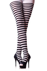 Woman legs in black and white stockings