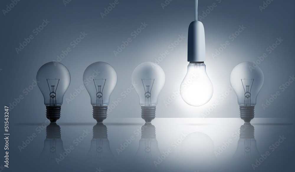 Poster five light bulbs in a row with one lit up
