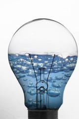 Light bulb and blue water inside