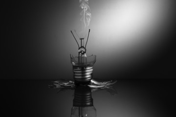 Broken light bulb smoking
