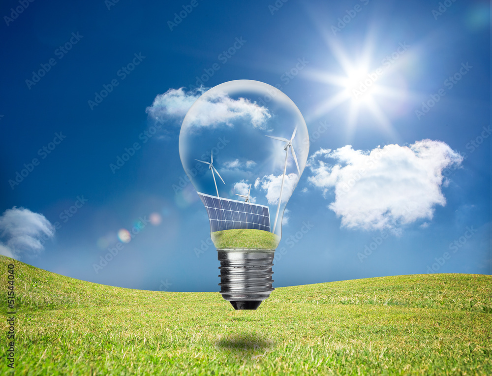 Poster Light bulb showing solar panels and turbines in a field