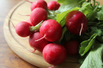 fresh radishes on cutting board