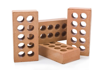 Stack of clay bricks isolated on white