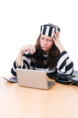 Criminal hacker with laptop on white