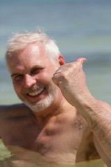 Thumbs up from a senior swimmer