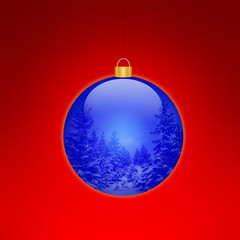 blaue weihnachtkugel mit winterlandschaft