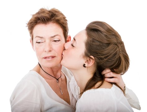daughter kissing mother