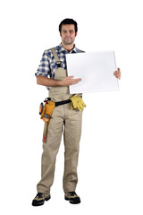 Carpenter stood with advertising panel