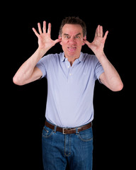 Fototapeta premium Angry Man Poking Out Tongue with Hands in Ears