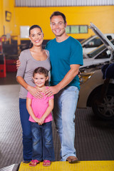 Obraz premium happy family in car service center