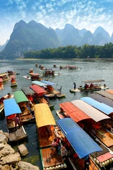 Foto auf Glas Bamboo raft at river near Yangshuo, Guanxi province, China © xiaoliangge