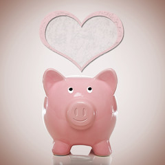 Piggy bank with pink heart