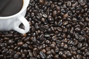 A cup of coffee and coffee beans background