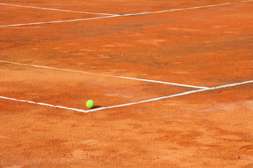 Tennis ball on a tennis clay court