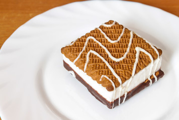 Biscuit cake on the plate.
