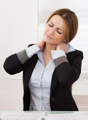 Young Attractive Businesswoman Suffer From Neck Pain