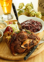 eisbein with braised cabbage, mashed potato, and beer