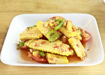 Thai food, corn salad with salted spicy sour dressing.