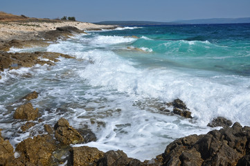 Blue waves crashing on a shoreline