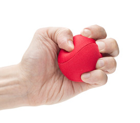 Hand squeezing red ball