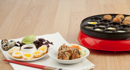 Takoyaki ball and fried eggs
