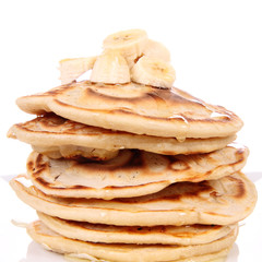 Pancakes with bananas and syrop