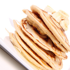 Pancakes with bananas and syrop
