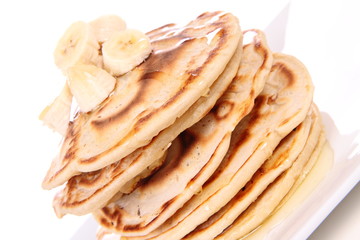 Pancakes with bananas and syrop