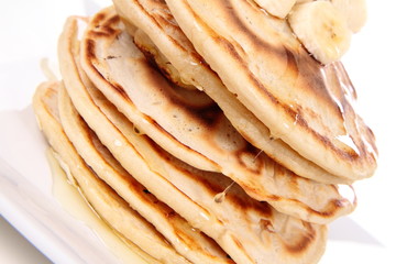 Pancakes with bananas and syrop