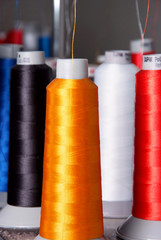 different color spools of threads