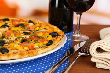 Tasty pizza with wine