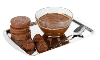 Bowl of chocolate and sweets isolated on white