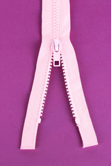 Zipper on purple background