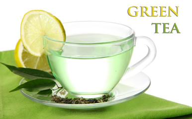 Transparent cup of green tea with lemon