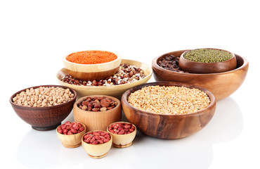 Different kinds of beans in bowls isolated on white
