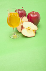 red apple close-up isolated on green background