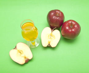 red apple close-up isolated on green background