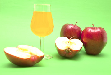 red apple close-up isolated on green background