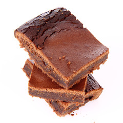 Slices of a brownie on white background