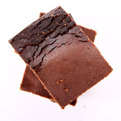 Slices of a brownie on white background