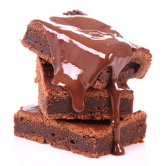 Slices of a brownie on white coverd with chocolate - 51576296