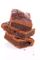 Slices of a brownie on white background