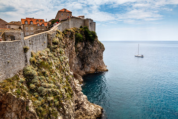 Fototapeta na wymiar Yacht and Impregnable Walls of Dubrovnik, Croatia