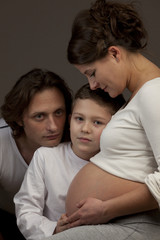 Pregnant mother with father and son