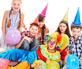 Obraz na płótnie Canvas Birthday party group of teen with clown.